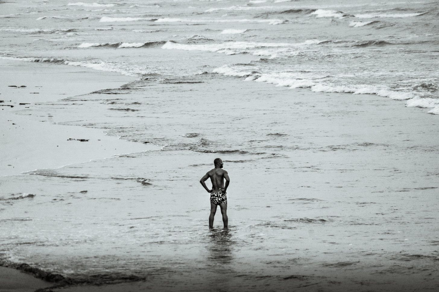A man standing alone on a beach in Accra, Ghana: A photo by David Elikwu, 