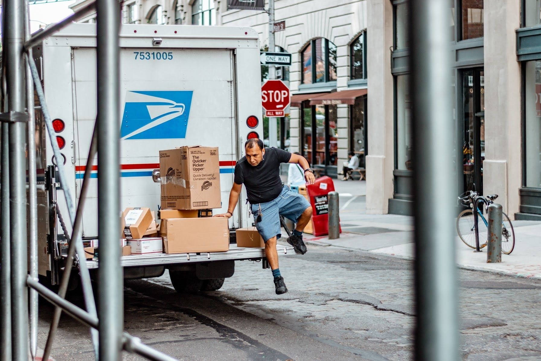 A delivery man taking off the container van in New York: A photo by David Elikwu